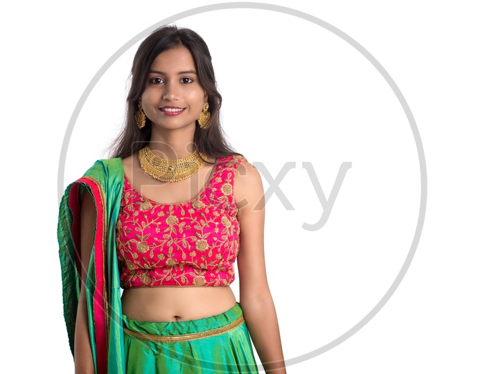 Portrait Of a Happy Young  Indian  Traditional   Woman  over a White Background