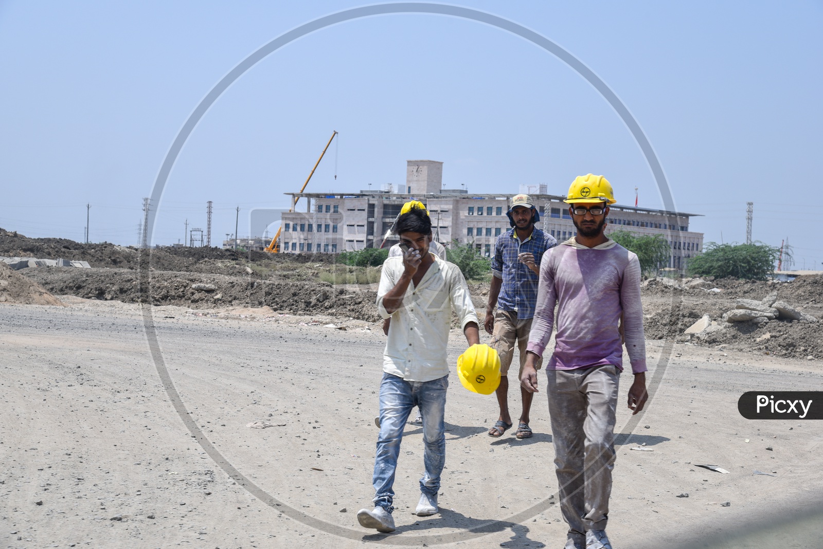 L&T  Workers Wearing Safety Caps at Construction Site