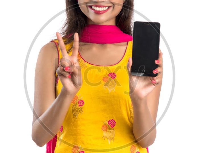 Beautiful Young Indian Girl Showing Mobile Screen With Smile Face and Gesture
