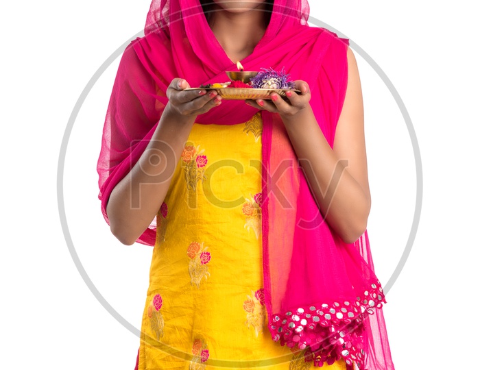 Beautiful Indian Girl Holding Pooja Thali Or Pooja Plate  In Hand