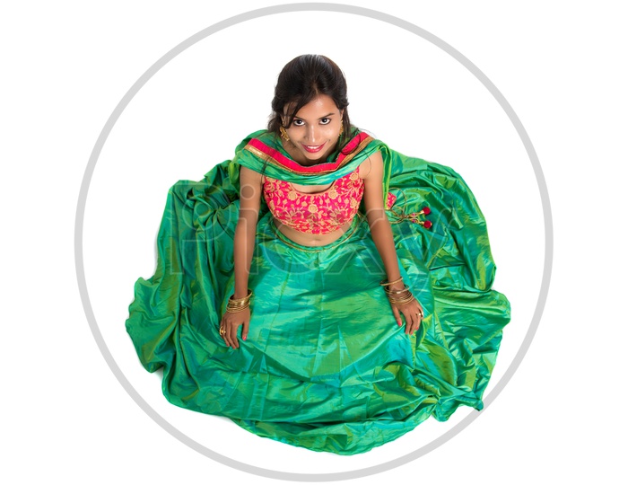 Portrait of a Young Indian Traditional Girl Sitting on Floor  With His Frock  wide Spread
