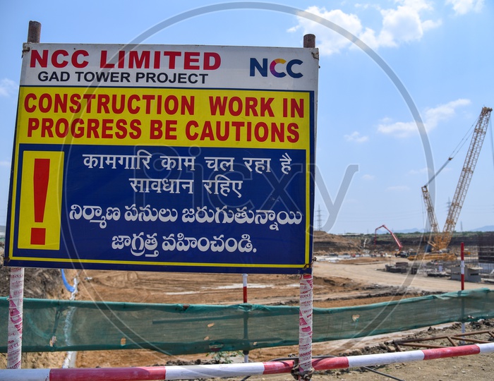 Caution Boards by Construction Company At Working Sites