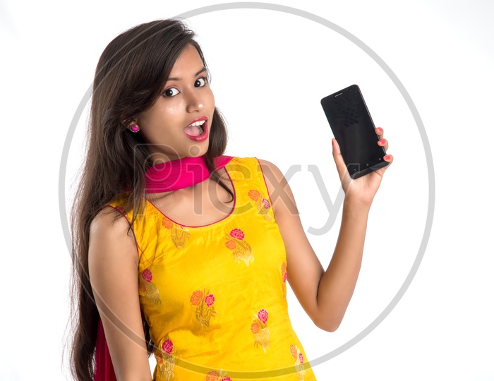 Beautiful Indian Girl Showing Smart Phone Screen With an Expression On Face