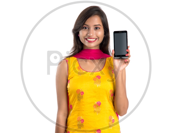 Image Of Beautiful Young Indian Girl Showing Mobile Screen With Smile 