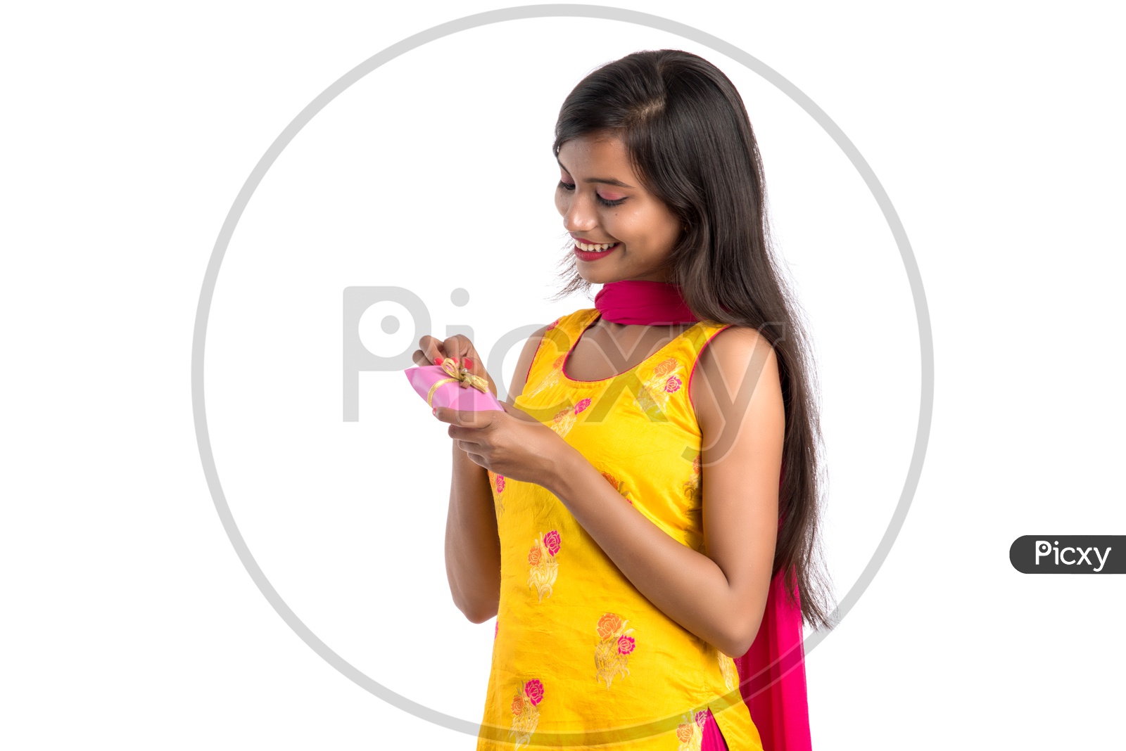 Beautiful Indian Girl Opening Gift With a Smile Face