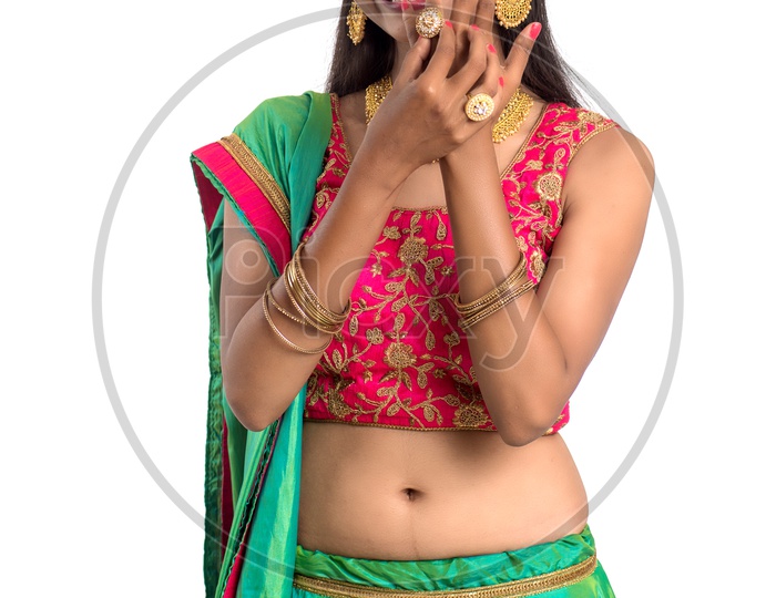 Portrait Of a Indian Traditional Young Woman  with a Expression On Face  Over a  White Background