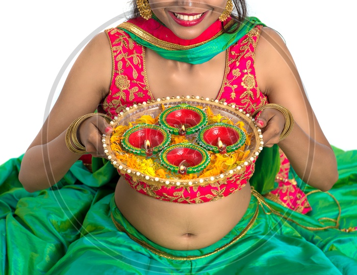 Portrait of a Young Traditional Indian Woman  Holding Festival Dia  Plate  in Hand