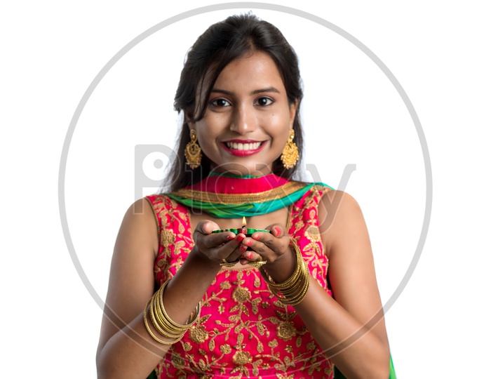 Portrait Of a Young Indian Traditional Woman Holding Dia in Hand Over  Isolated White Background