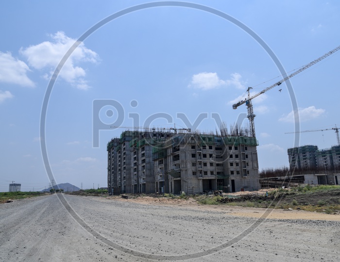 Construction of High Rise Buildings And Cranes at Construction Sites
