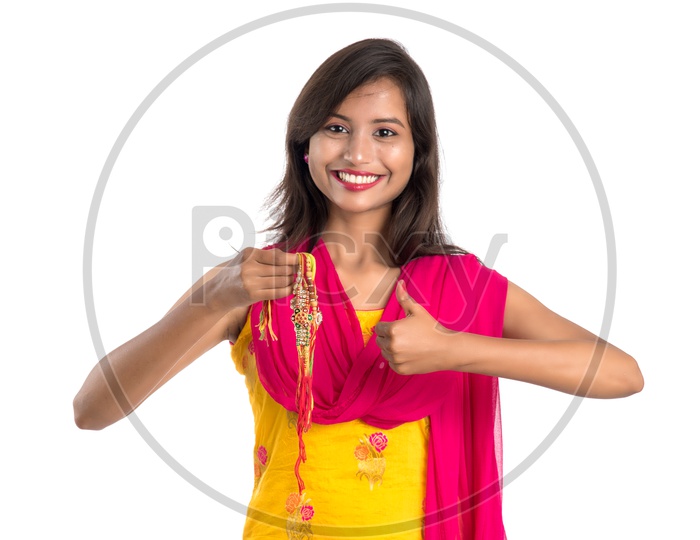 Image Of Beautiful Indian Girl Showing Rakhis On Occasion Of Raksha
