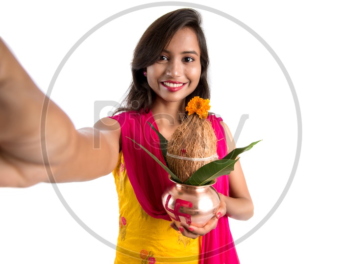 Beautiful Indian Girl Taken Selfie holding Copper Kalash  In Hand