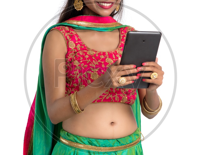 Indian Young Traditional Woman  looking at Smart Phone Screen With an Expression