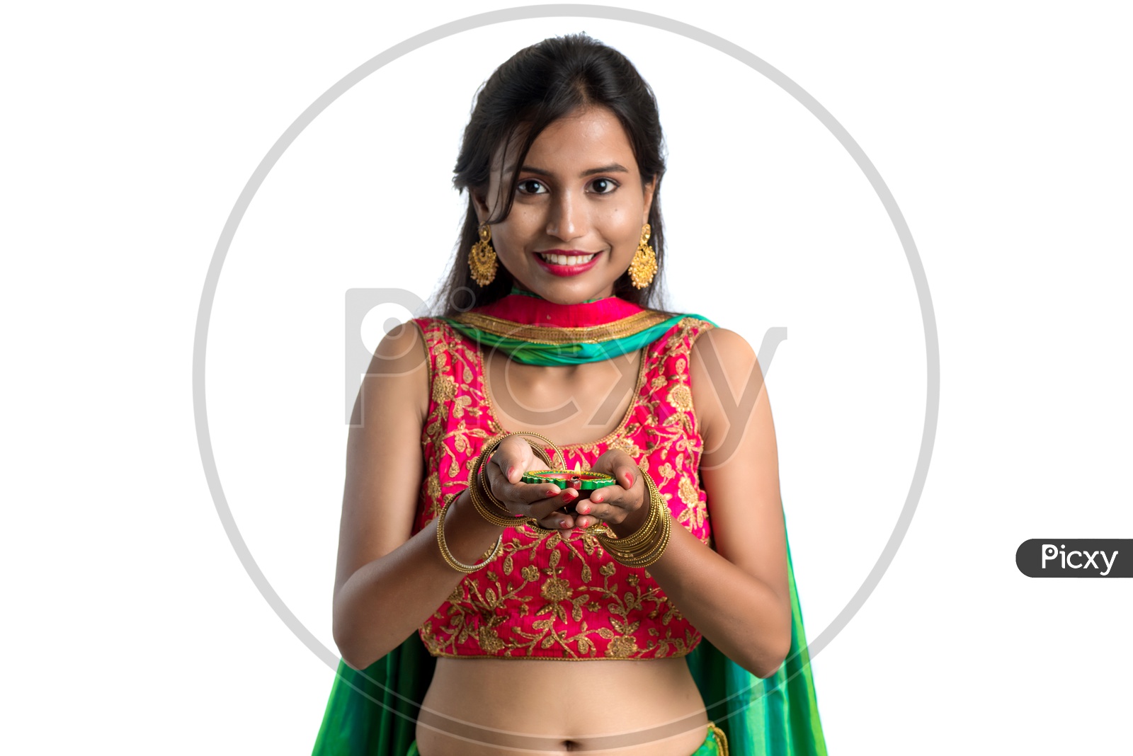 Portrait of a Young Indian Traditional Girl  Holding    Dia In Hand  Over an Isolated White Background