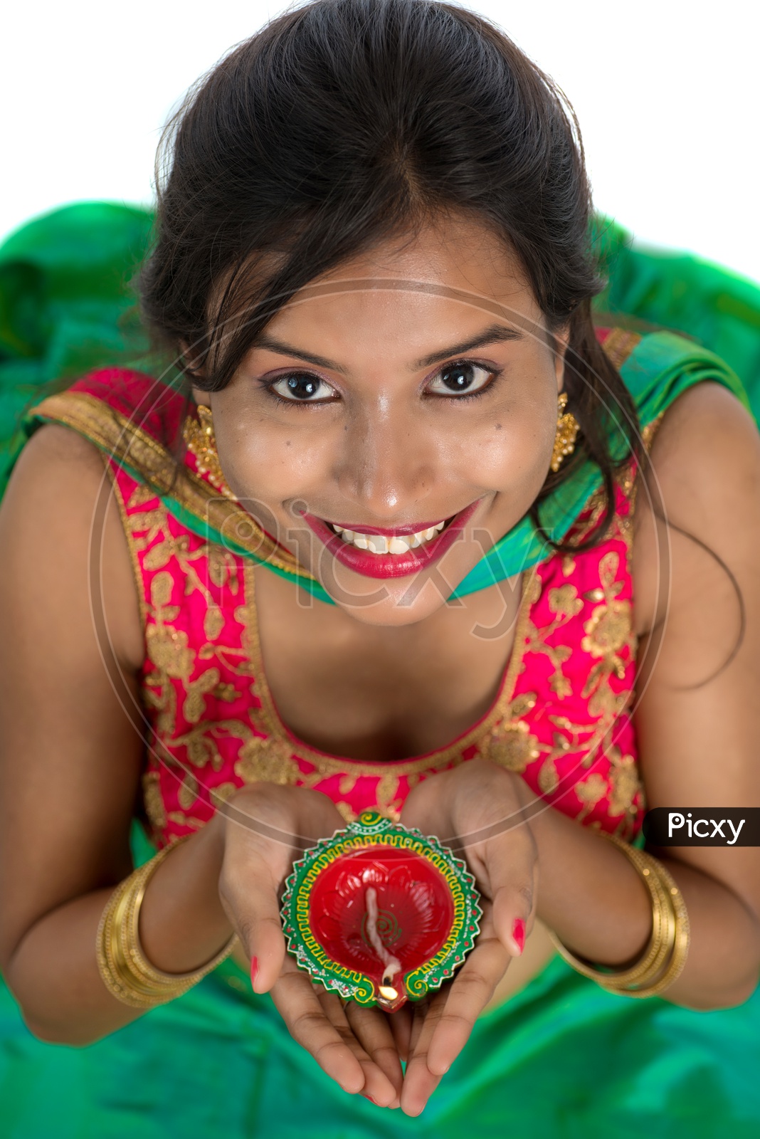 Portrait of a Young Traditional Indian Woman  Holding Festival Dia  in Hand