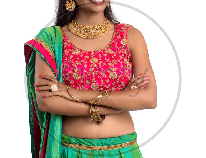 Portrait Of a  Traditional Young Indian Woman  With a  Expression and Gesture over a White  Background