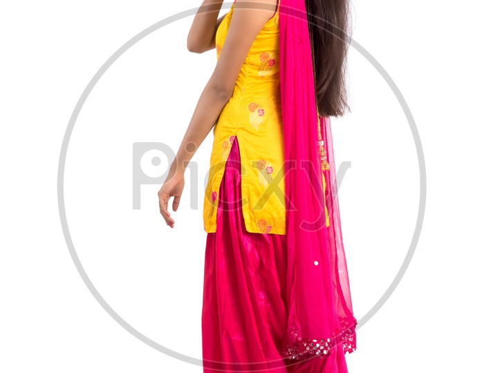 Portrait of  a Beautiful Indian Girl With Happy Expressions and Posing  over an Isolated White Background