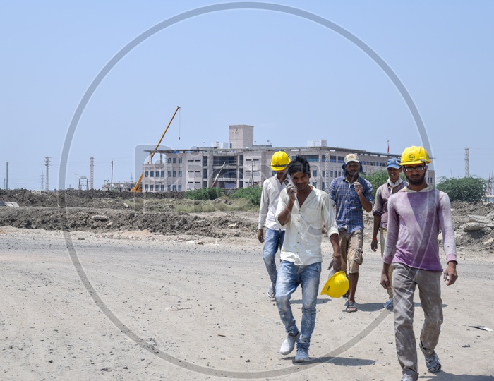 L&T Construction Company Workers Wearing Safety Helmets At Construction Site