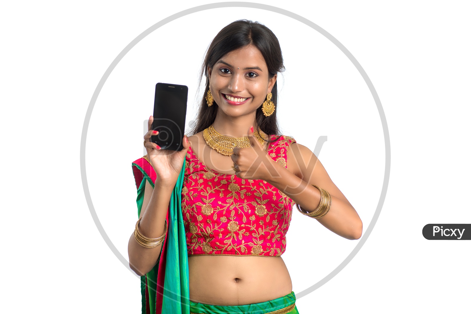 Portrait of a Young Traditional Indian  Woman  Showing Mobile Screen With an Expression and  a Gesture  over a White Isolated Background