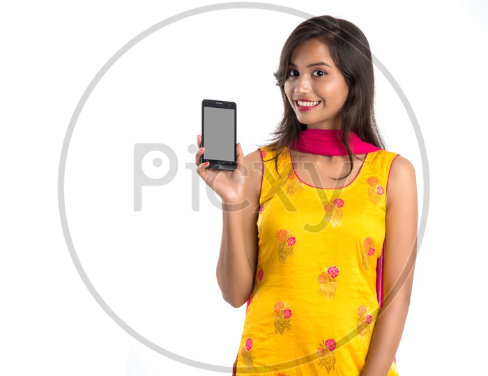 Image Of Beautiful Traditional Indian Girl Showing Smart Phone Screen 