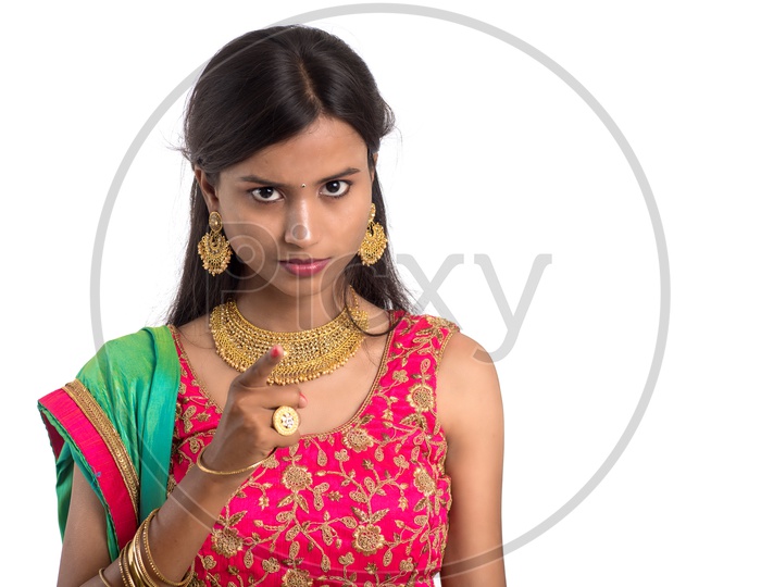 Portrait Of a Indian Traditional Young Woman  with a Expression On Face and Gestures   Over a  White Background