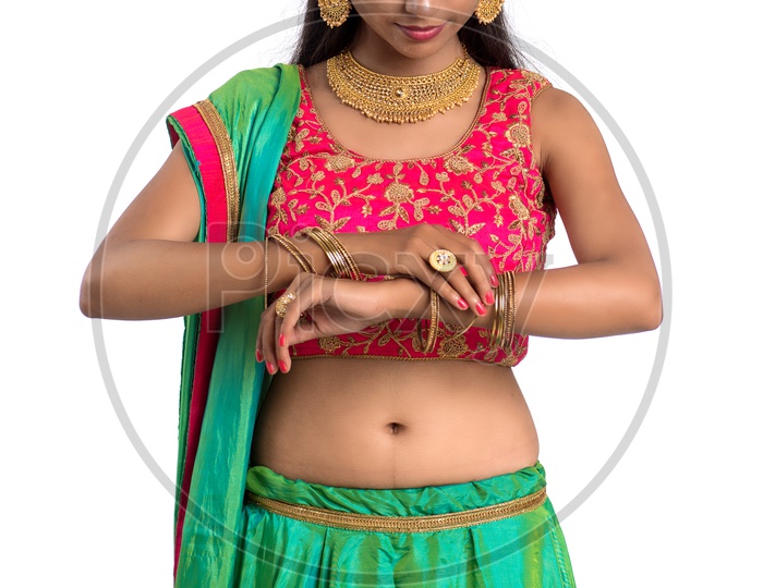 Portrait Of a Indian Traditional Young Woman  with a Expression On Face and Gestures   Over a  White Background