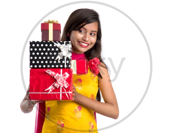 Beautiful Indian Girl Holding Gift Boxes In Hand