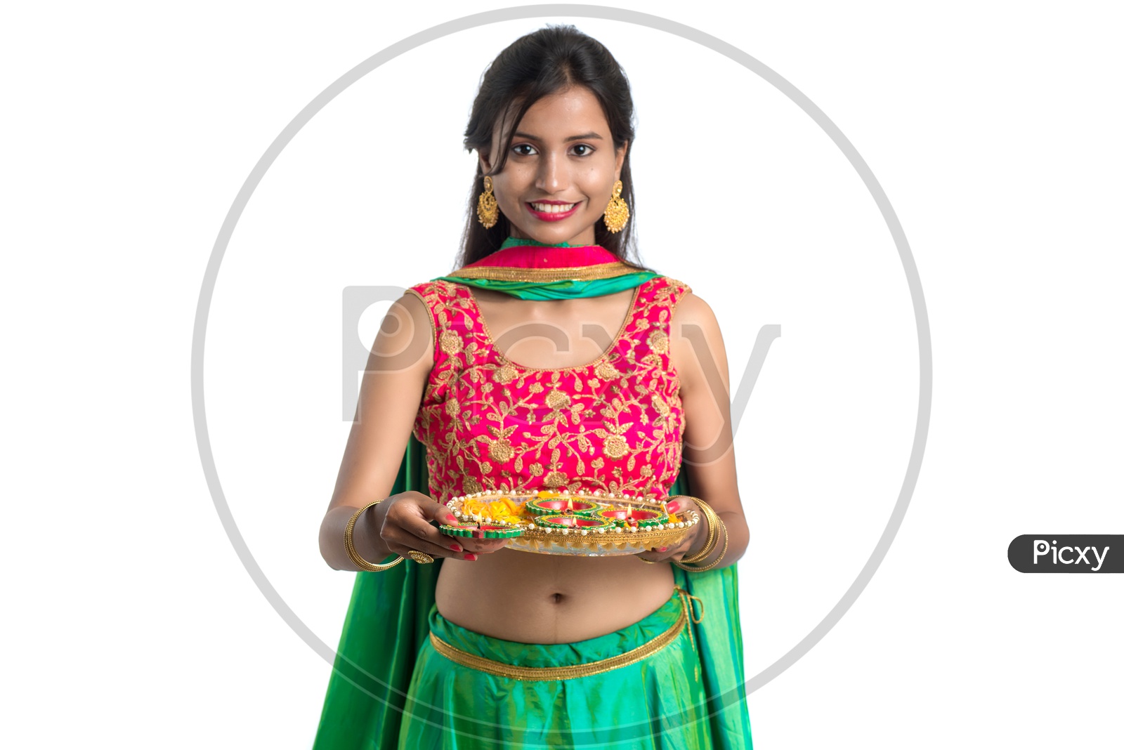 Portrait of a Young Indian Traditional Girl  Holding  Dia Plate And  Dia In Hand  Over an Isolated White Background