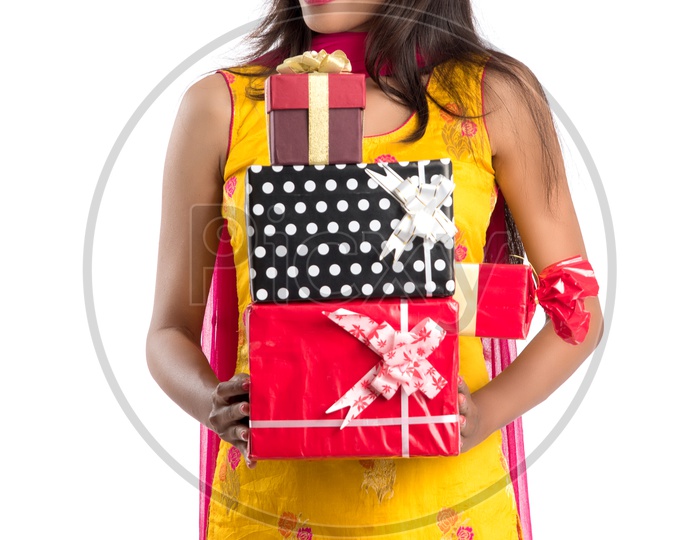 Beautiful Indian Girl With Gift Boxes In Hand with a Smile Face