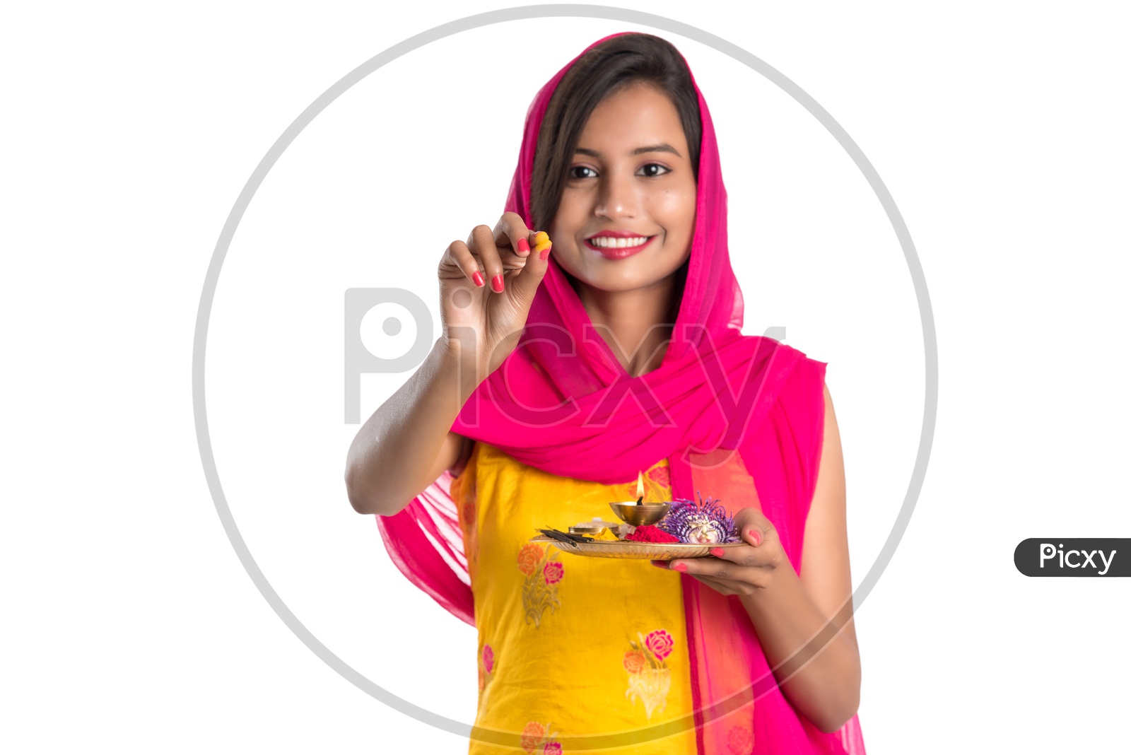 Beautiful Indian Girl Holding Pooja Thali Or Pooja Plate  In Hand and performing  Worship