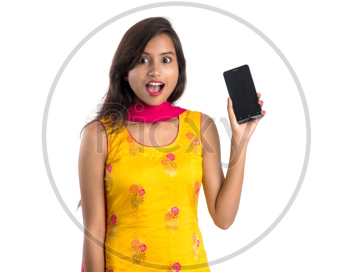 Image Of Beautiful Traditional Indian Girl Showing Smart Phone Screen 