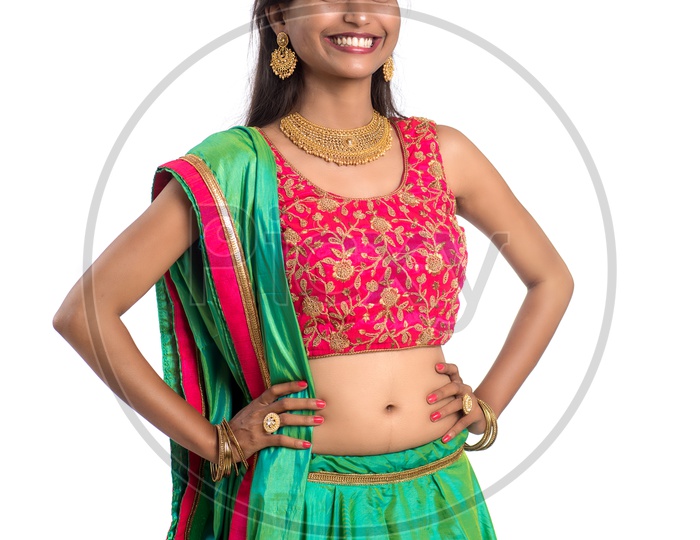 Portrait Of a  Traditional Young Indian Woman  With a  Expression and Gesture over a White  Background