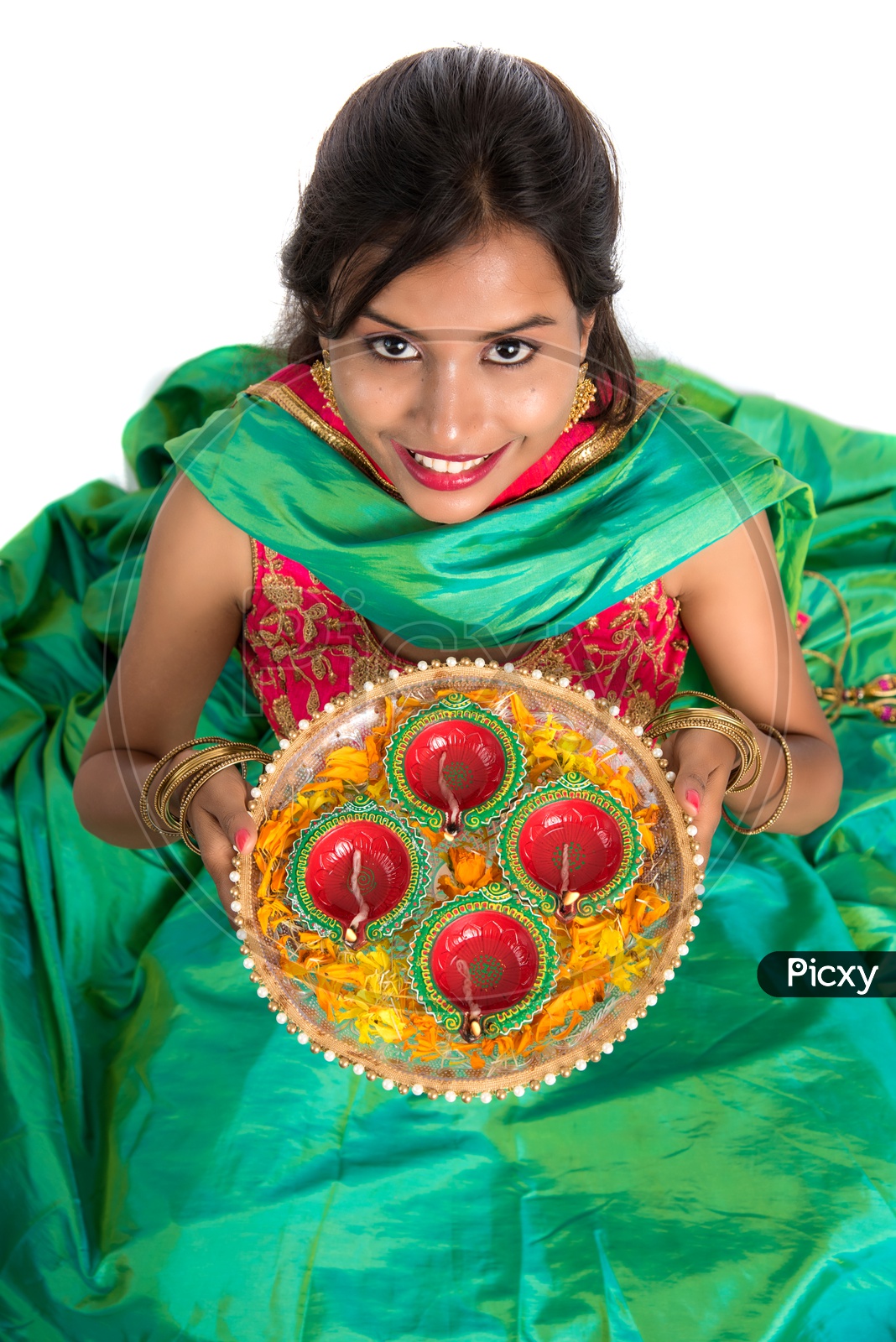 Beautiful Indian Traditional Young woman Holding Festival Dia Thali In hand