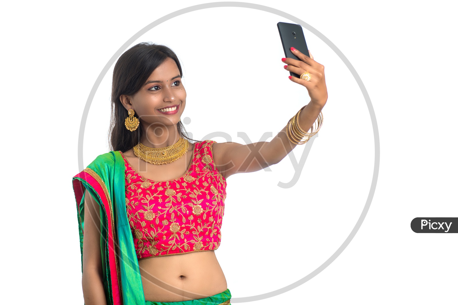 Portrait Of a Happy Young Traditional Indian Woman  Taking selfie With Smart Phone