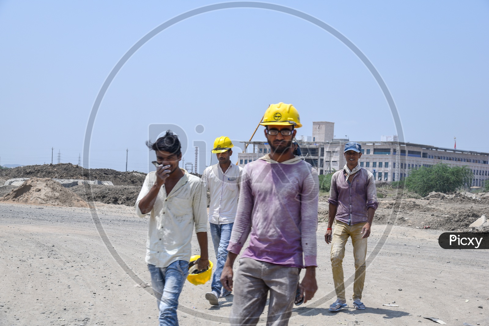 L&T Construction Company Workers Wearing Safety Helmets At Construction Site