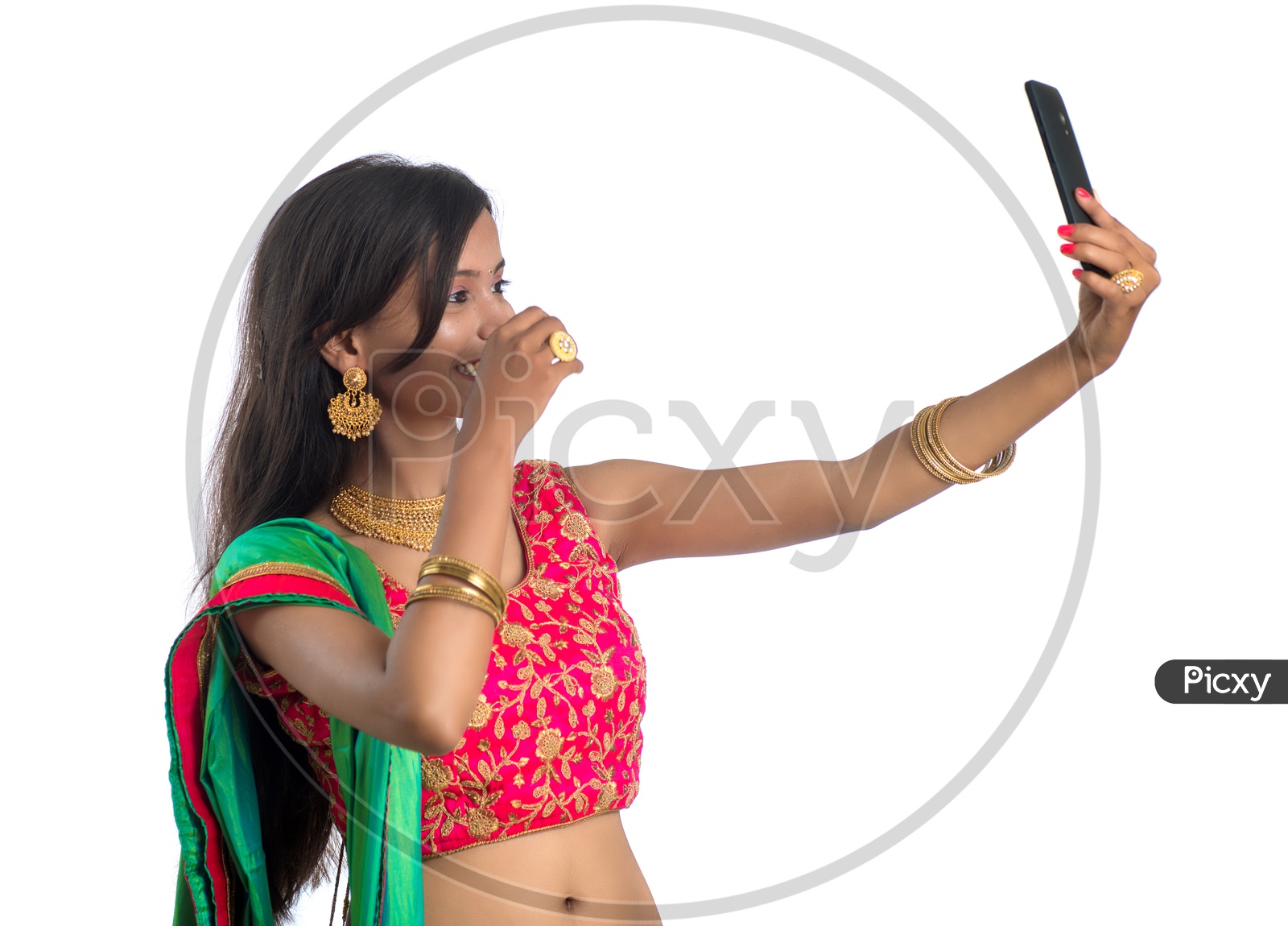 Portrait Of a Happy Young Traditional Indian Woman  Taking selfie With Smart Phone