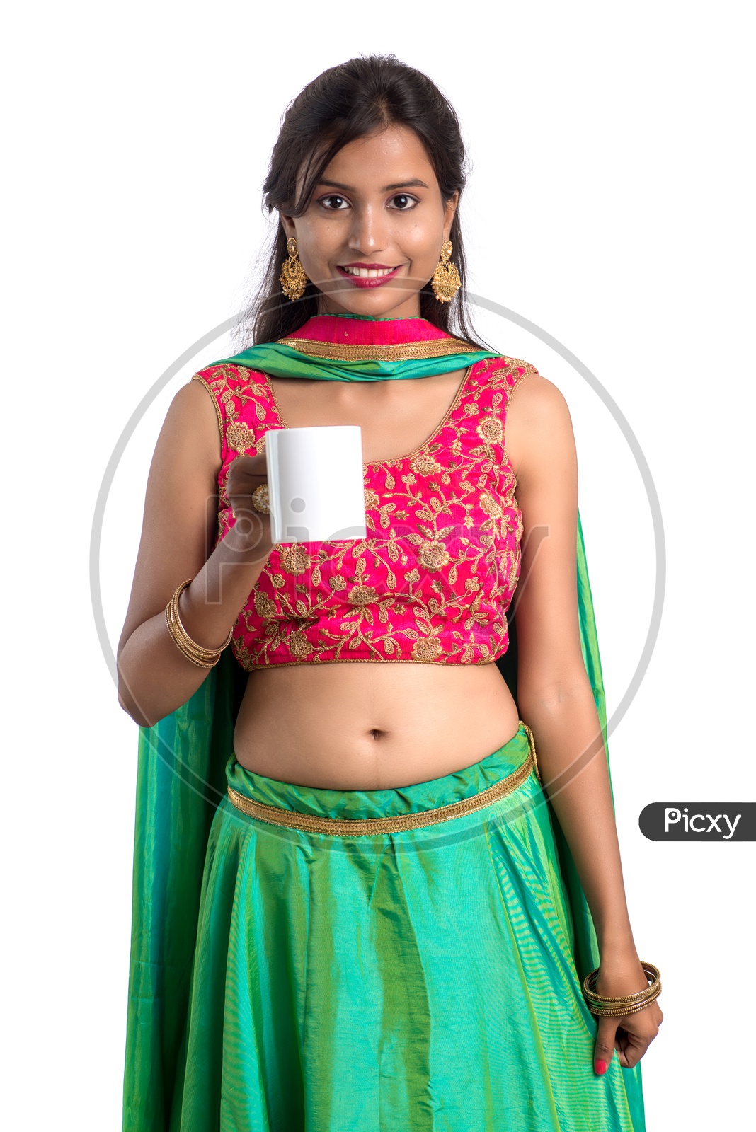 Portrait Of a Young Indian  Traditional Girl Enjoying a Cup of Tea Or Coffee Over a White Background