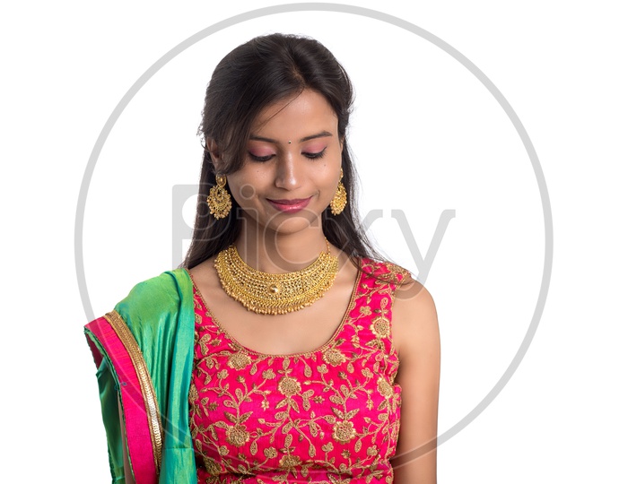 Portrait Of a Happy Young  Indian  Traditional   Woman  over a White Background