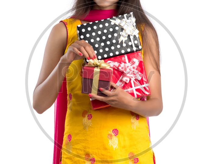 Beautiful Indian Girl Holding Gift Boxes In hand with a  Smile Face