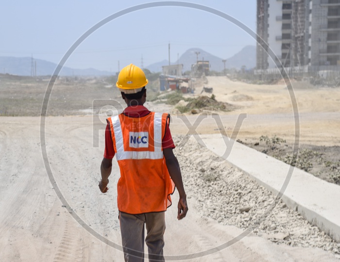 Construction Worker With Safety Helmets and Safety Reflective Vests