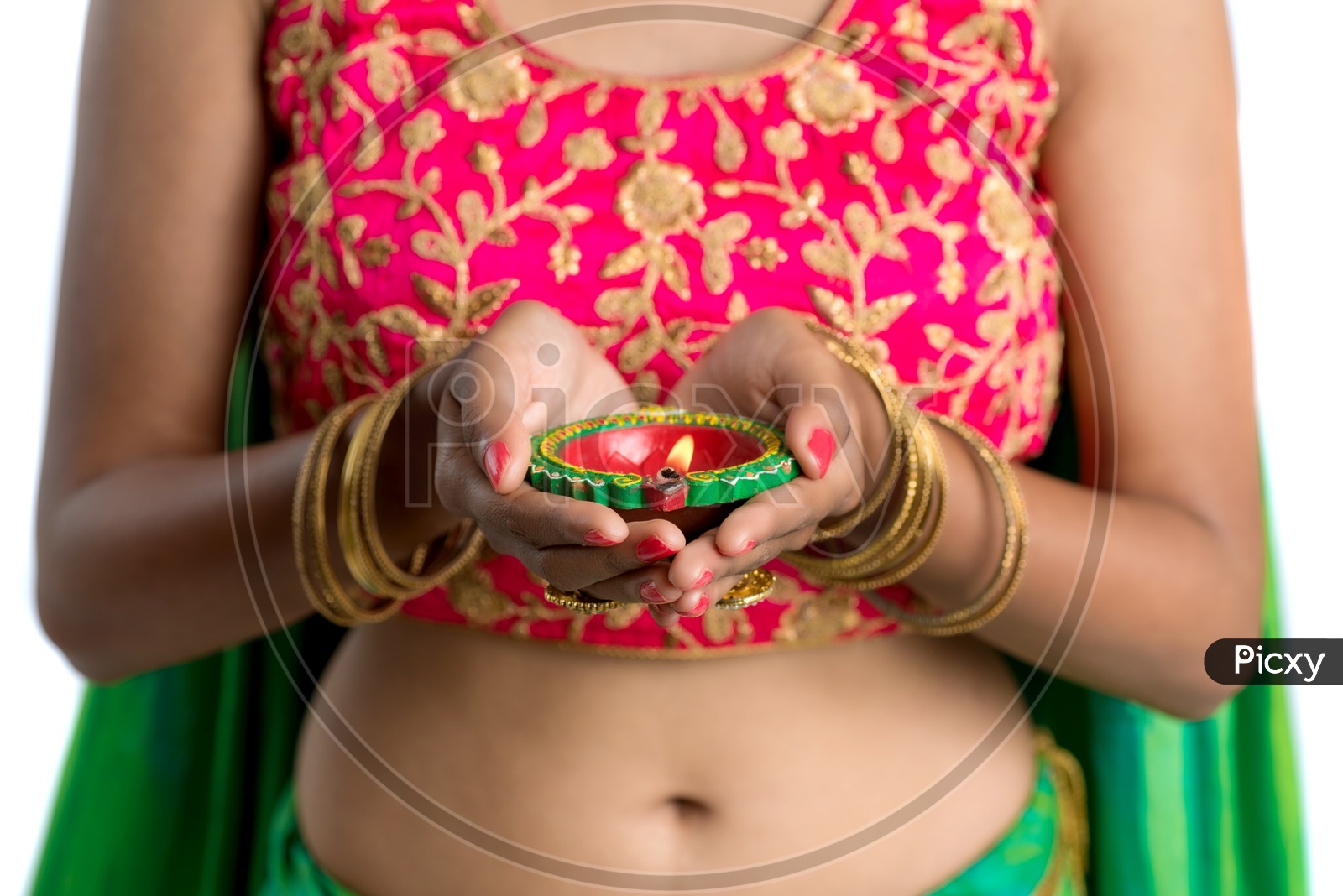 Portrait Of a Young Traditional Indian Woman Holding Festival Dia in Hand over a White Isolated Background