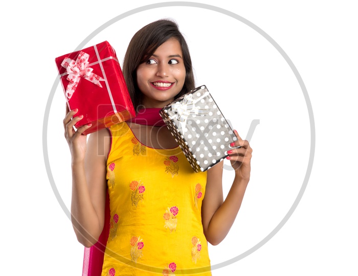Beautiful Indian Girl With Gifts In Hand with a Smile Face