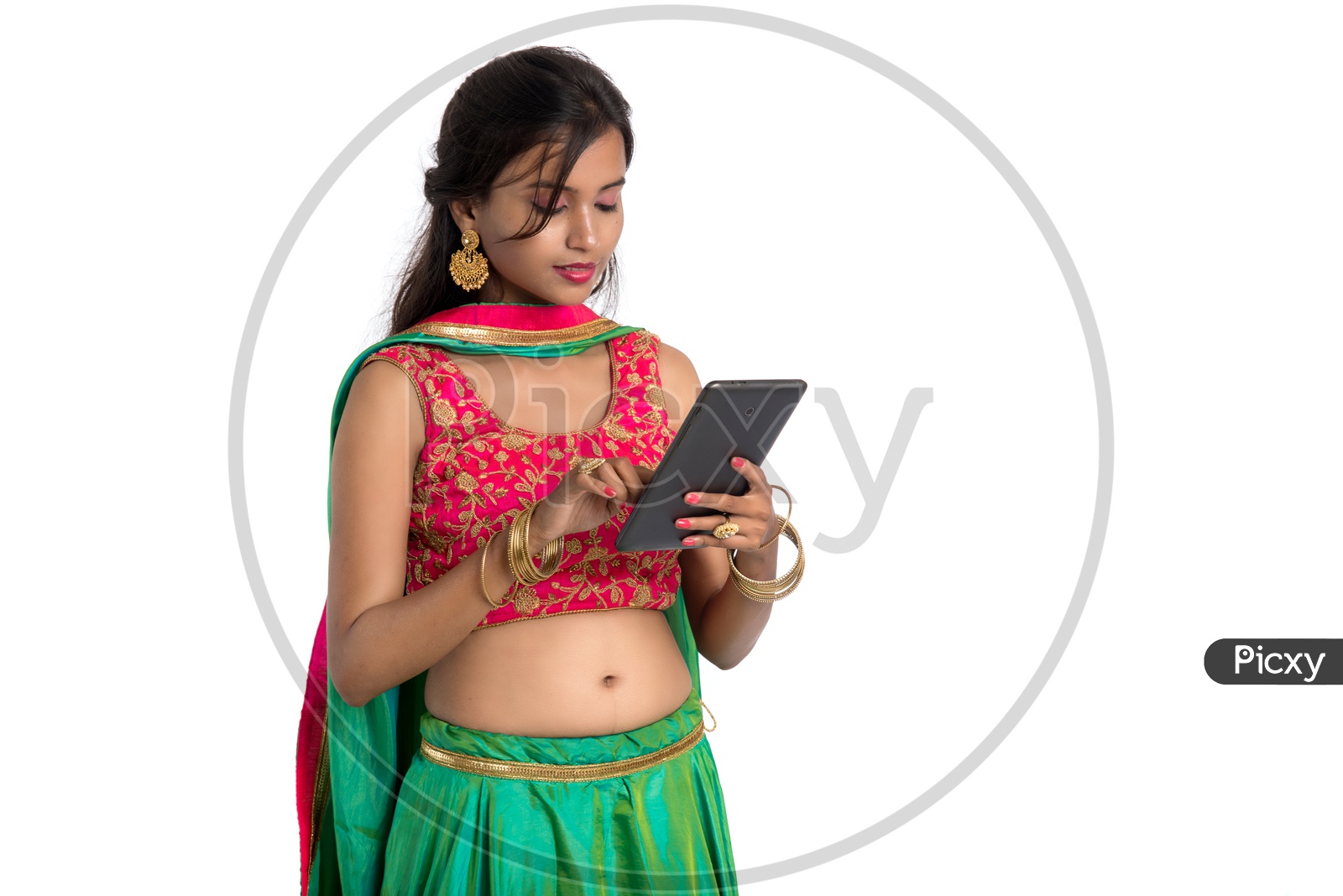 Portrait Of a beautiful Traditional Indian Woman Looking at a Smart Phone And  With a Smile Face