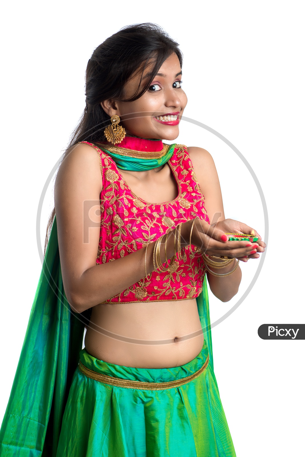 Portrait Of a Young Indian Traditional Woman Holding Dia  In Hand  Over a White Background