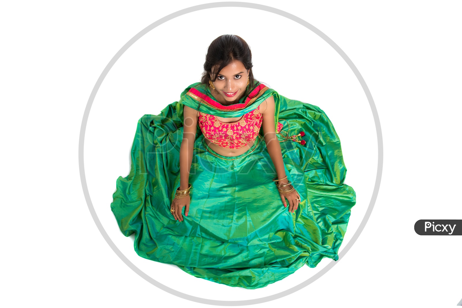 Portrait of a Young Indian Traditional Girl Sitting on Floor  With His Frock  wide Spread