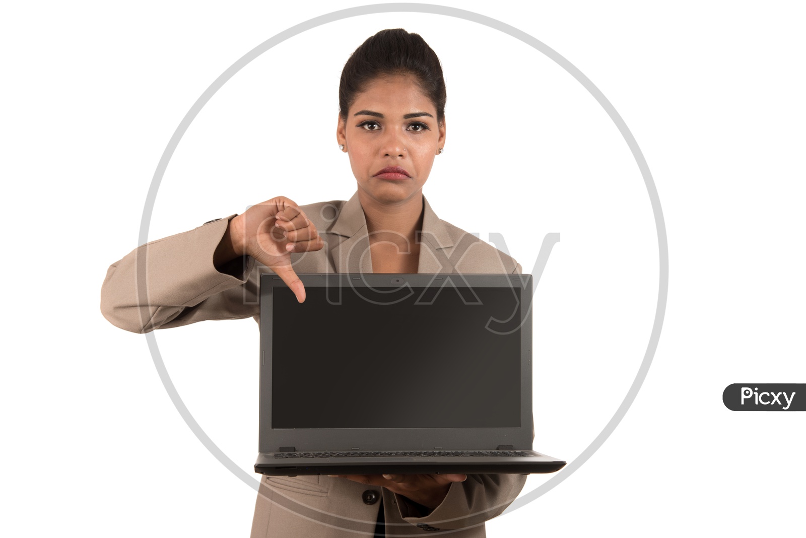 Young Indian business woman holding a laptop giving thumbs down sign