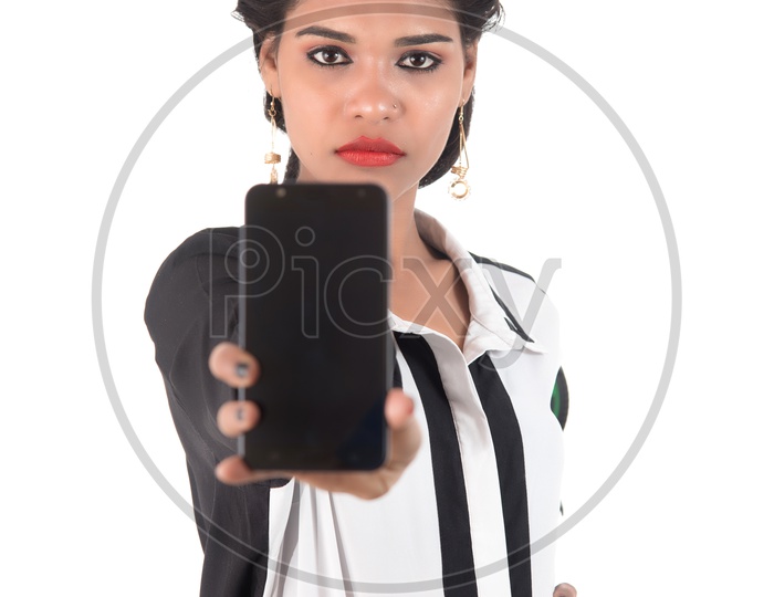 Young Indian Woman Showing Blank Smart Phone Screen and Posing On White Background