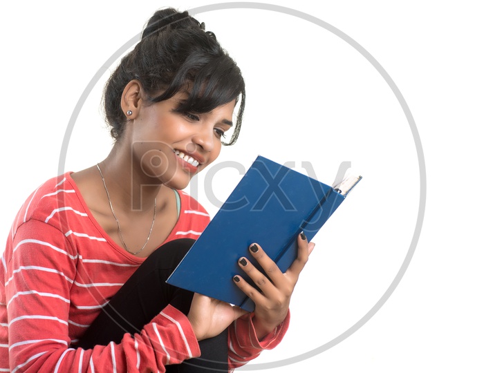 A Pretty Indian Girl Holding Book and Reading On an Isolated white Background