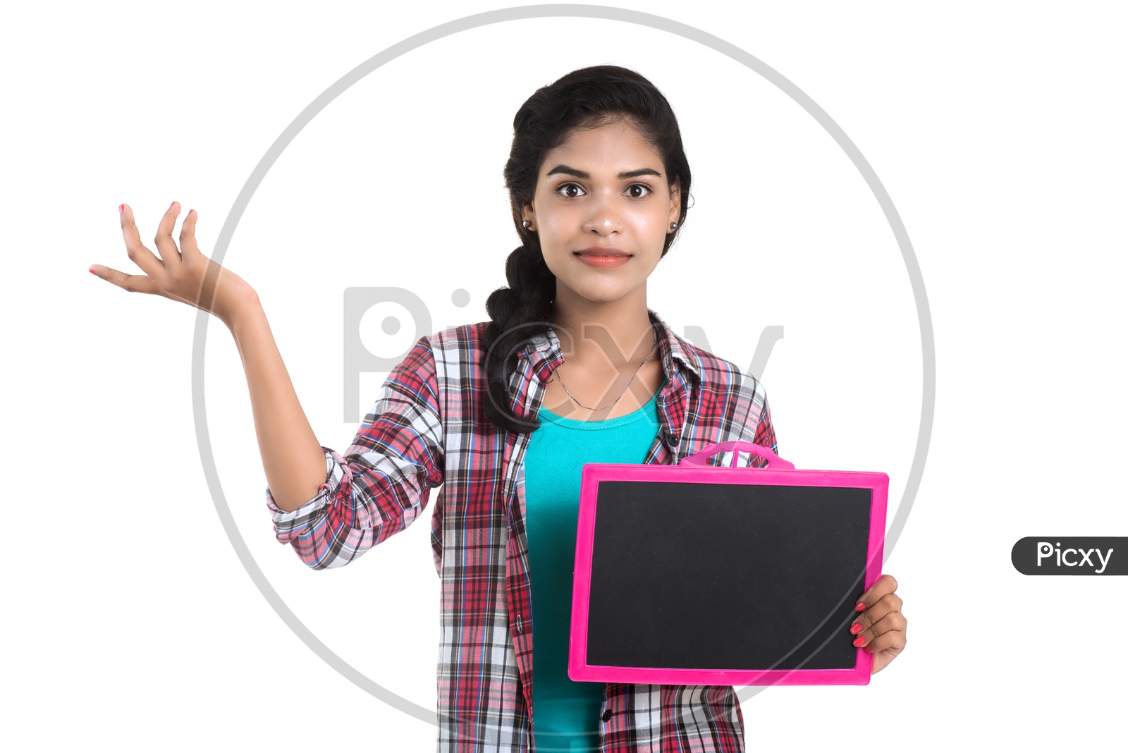 Young Indian Girl Showing a Slate Board  and Pointing The Empty Space on an Isolated White Background