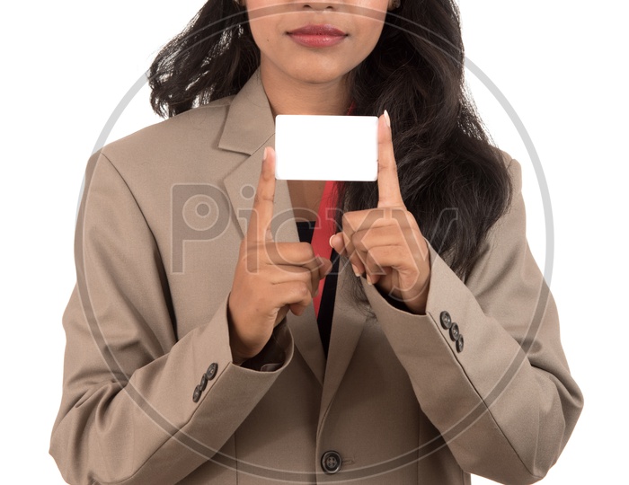 Smiling business woman holding a blank business card or ID card