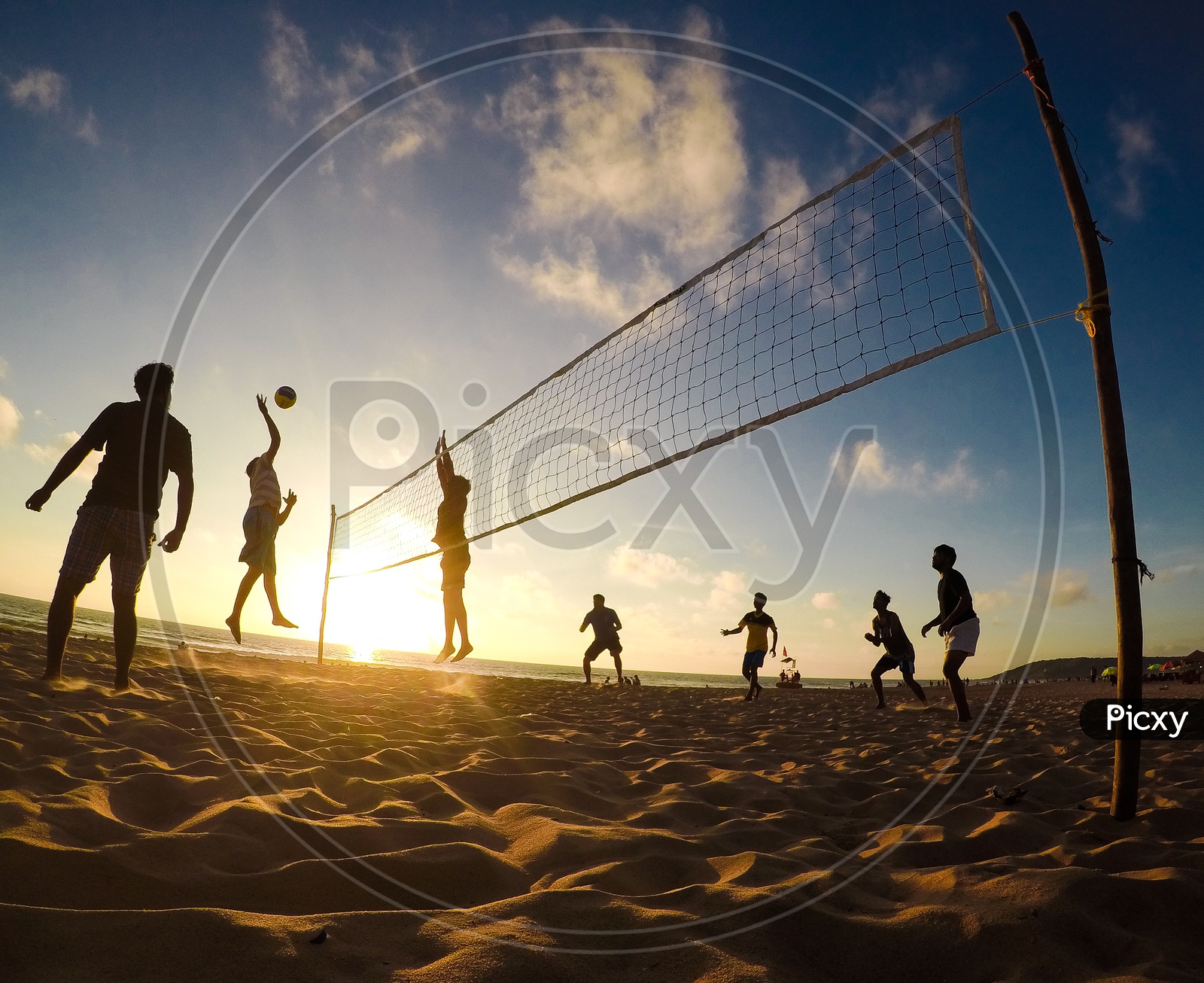 People Playing Beach Volleyball In a Beach